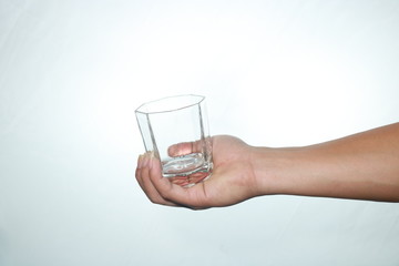 hand with glass of water