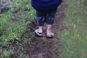 little boy in dirt road