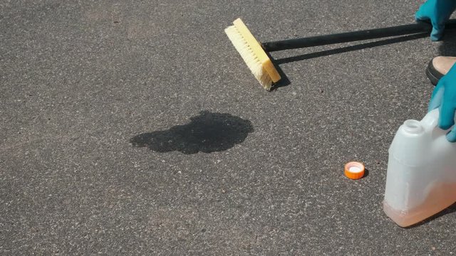 Cleaning Dry Driveway Oil Spot with Soap and Brush, view 3, 4k