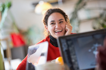 Happy young female colleague student studying