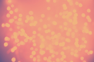 Light warm bokeh lights on muted rose drop. Holiday, Party, Christmas and New Year background. Ideal to layer with any design and add text. Horizontal