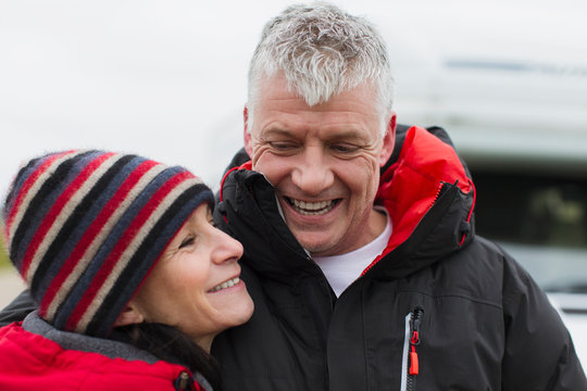 Affectionate couple in warm clothing