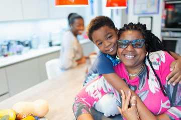 Portrait affectionate grandmother and grandson hugging