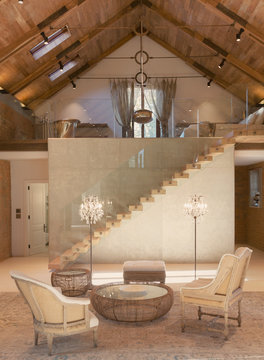 Home showcase interior sitting area and loft with vaulted ceiling
