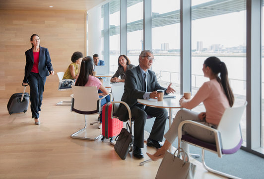 Business People Working And Talking In Airport Business Lounge