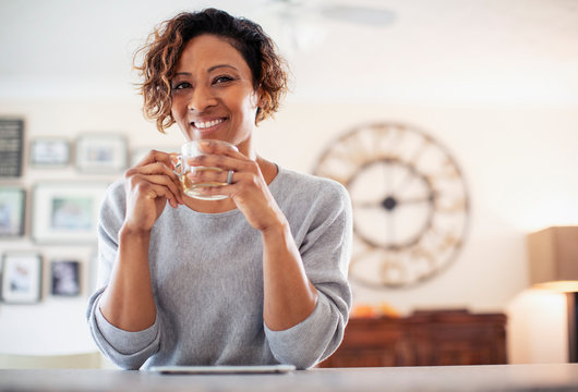 Portrait smiling, confident woman drinking tea