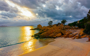 Landscape with Romantic sunset at Capriccioli Beach in of the Mediterranean sea on Sardinia island...