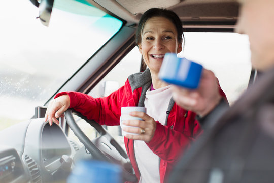 Couple drinking coffee in motor home