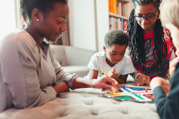 Multi-generation family playing board game