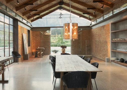 Home showcase interior dining room with vaulted ceiling and chandelier