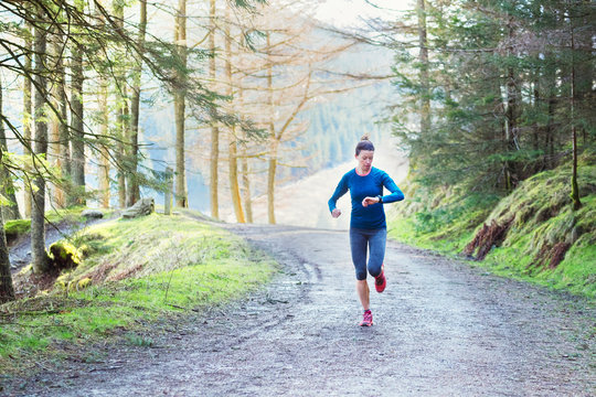 Woman jogging in woods