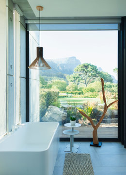 Fototapeta Modern, luxury bathroom with soaking tub and scenic view