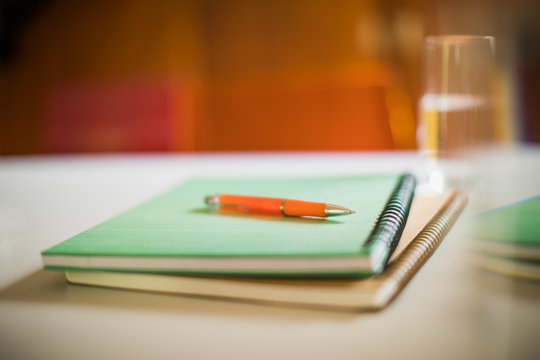 Close up spiral notebooks and pen