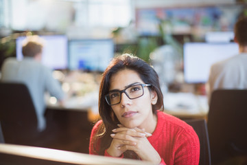Portrait serious, thoughtful businesswoman working in office