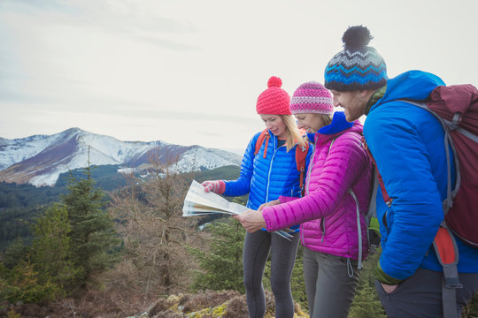 Friends with map hiking