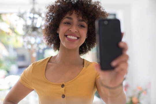 Happy Young Woman Taking Selfie With Camera Phone