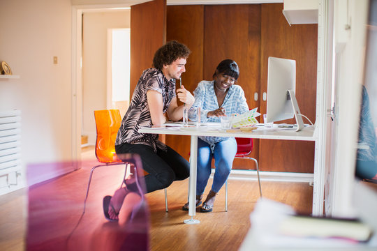 Young creative entrepreneurs working in home office