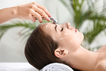 Young woman having massage in beauty salon