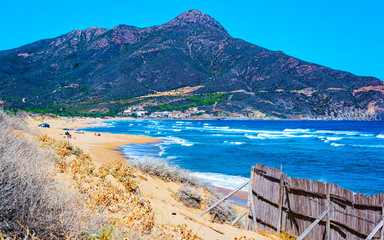 Naklejka premium Cala Domestica beach in Buggerru resort at the Mediterranean Sea near Masua and Cagliari province in Carbonia-Iglesias, Sardinia in Italy. Landscape and scenery.