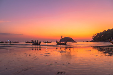 scenery sunset above fishing boats at Kata beach Phuket
