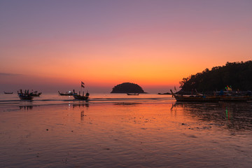 scenery sunset above fishing boats at Kata beach Phuket