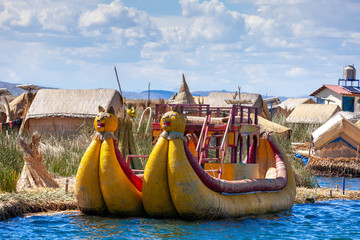 Close-up traditional reed boat as transportation for tourists, floating Uros islands on lake...