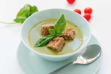 Pea cream soup on the dinner table