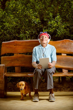 Man sitting on bench with dog