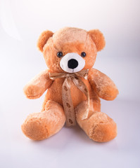Toy or Teddy bear with bow on the background new.