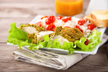 Chicken fillet in a green breading with a garnish. Selective focus. Copy space.