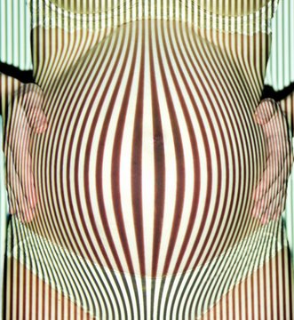 Close up of pregnant woman touching her stomach