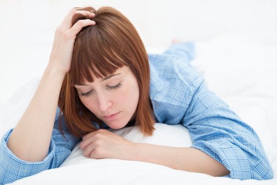 Woman with hand in hair