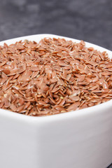 Linseed in glass bowls. Healthy food containing vitamins, fiber and acids omega