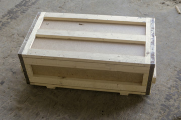 Cargo in a wooden crate on the floor of the warehouse