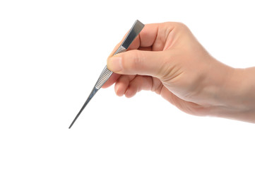 Close up of man's hand holding an tweezers.
