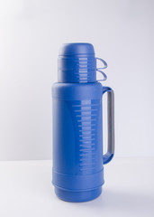 Thermo or Plastic Thermos flask on background new.