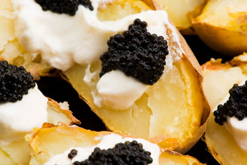 Baked potato with spiced cream cheese and caviar