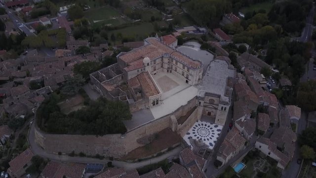 Aerial famous Grignan palace in provence at sunrise from above france