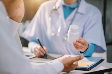 Doctors explain the use of medication to patients. healthcare and medical concept.