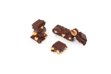 Chocolate pieces with nuts isolated on white background