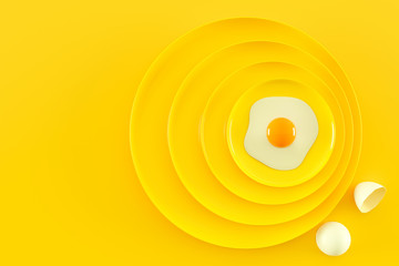 Fried eggs on many plates stacked together.