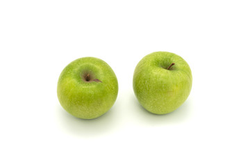 Two green apples isolated on white background