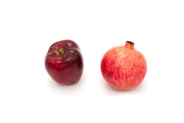 Fototapeta na wymiar Pomegranate and red apple isolated on white background