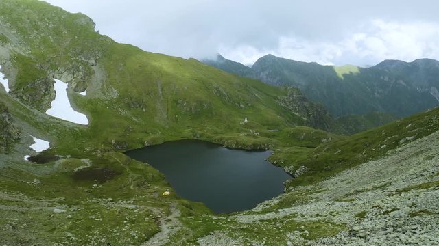 4K A Couple Hikes Carpathian Mountains Drone Footage Overlooks Lake Low Flying