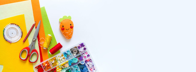 Carrot made of felt. Toy Easter holiday rabbit. Copy space Banner