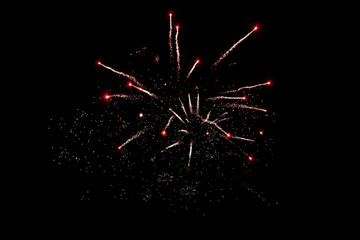 Silver red shiny background on black. Firework.