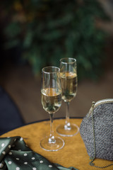 Champagne in champagne flutes on the table in cafe. 