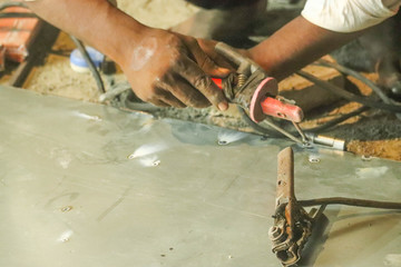 Indian Laborer Worker Hands Doing Metal Welding Of Aluminum With Tools