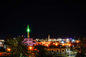 Fototapeta na wymiar Siwa Oasis, Egypt The Siwa skyline and mosque at night.