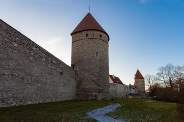 The fortress wall of the old city with two towers in Tallinn (Estonia)